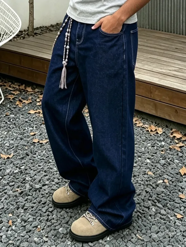 Denim Blue Dark Topstitched Wide-Leg Jeans Are the Same for Men and Women. They Are High-Waisted Loose and Floor-Length. They A