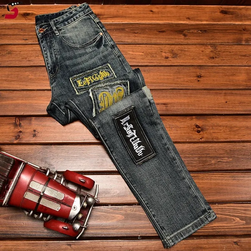 High-End Jeans Pánská podzimní a zimní móda roztrhaná nášivka Pu Shuai vyšívané Slim Fit úzké strečové kalhoty s potiskem
