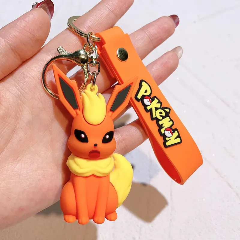 40 Style Wholesale Anime Pokémon Pikachu Eveen Keychain Cartoon Cute Charizard Keyring Student Backpack Car Key Chain Toys Gifts
