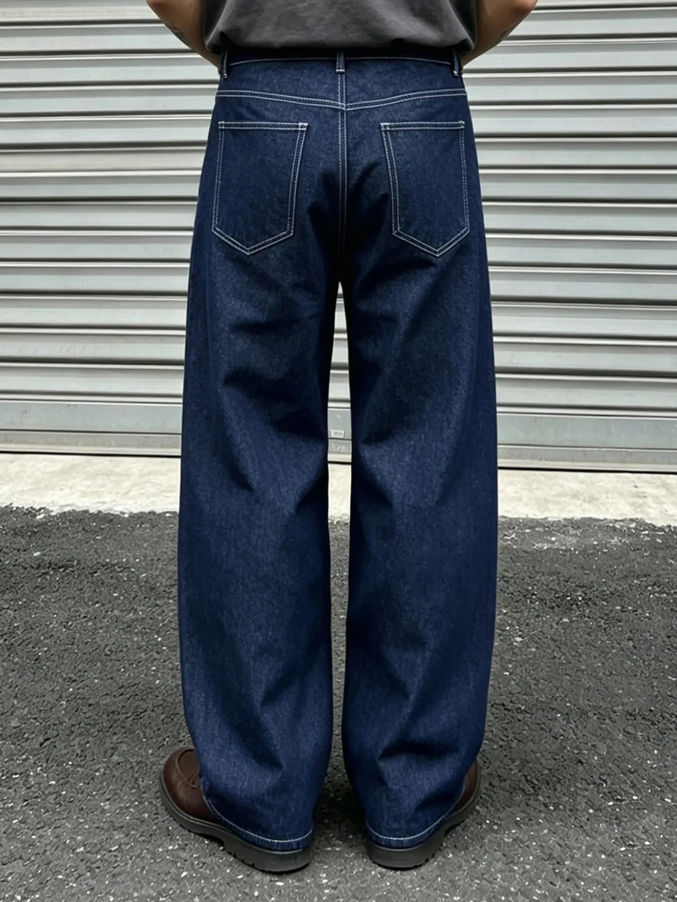 Denim Blue Dark Topstitched Wide-Leg Jeans Are the Same for Men and Women. They Are High-Waisted Loose and Floor-Length. They A
