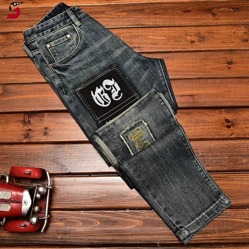 High-End Jeans Pánská podzimní a zimní móda roztrhaná nášivka Pu Shuai vyšívané Slim Fit úzké strečové kalhoty s potiskem