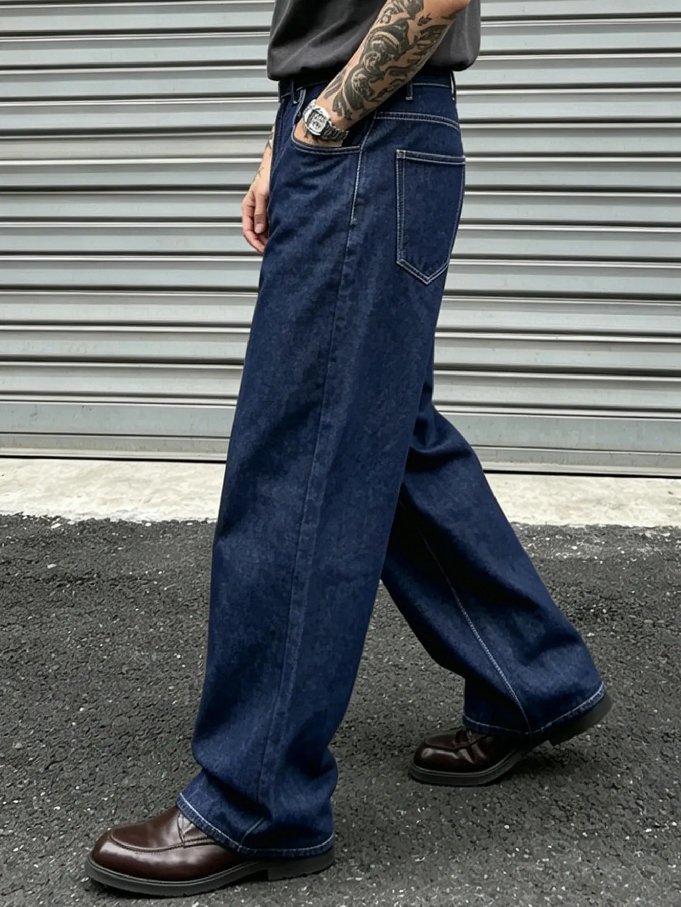 Denim Blue Dark Topstitched Wide-Leg Jeans Are the Same for Men and Women. They Are High-Waisted Loose and Floor-Length. They A